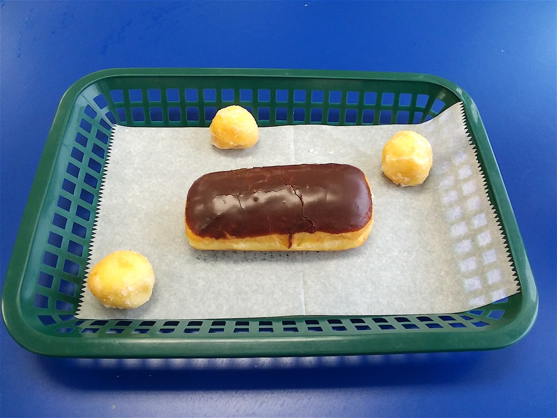 a photo of an E-clare and three donut holes